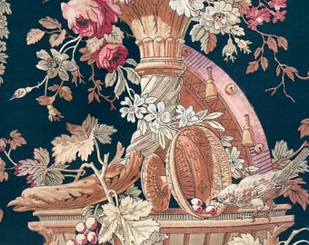 May include: A dark green fabric featuring a printed pattern of pink and white roses, grape clusters, and a bird perched near a pedestal bowl. The design includes architectural elements like a fluted column and a curved structure with small bells.
