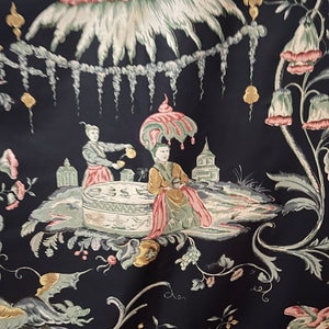 May include: A black fabric with a repeating pattern of stylized flowers, plants, and figures. The figures are dressed in pink, green, and yellow clothing. The fabric has a vintage feel.
