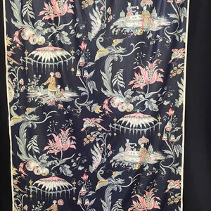 May include: A dark blue fabric with a repeating pattern of pink flowers, green leaves, and white figures in a landscape setting. The figures are wearing traditional Chinese clothing and are holding teacups.