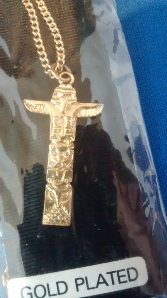 Gold Plated Totem Pole Charm With Interesting Curi