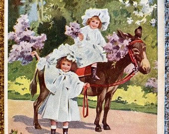 Antique Victorian Postcard with kind remembrance girls and donkey