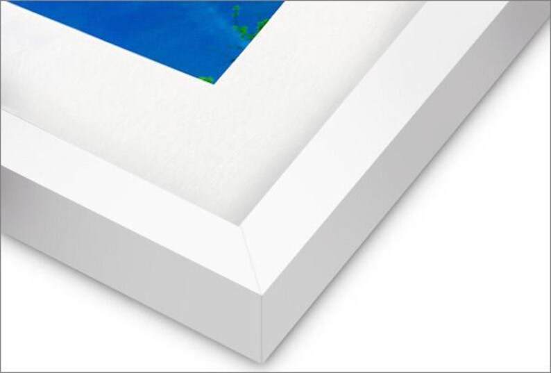 May include: Close-up of a white picture frame with a beveled edge. The frame is made of wood and has a smooth finish.