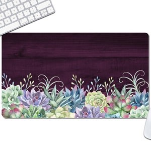 May include: A purple woodgrain desk mat with a border of watercolor succulents in shades of green, blue, and pink.