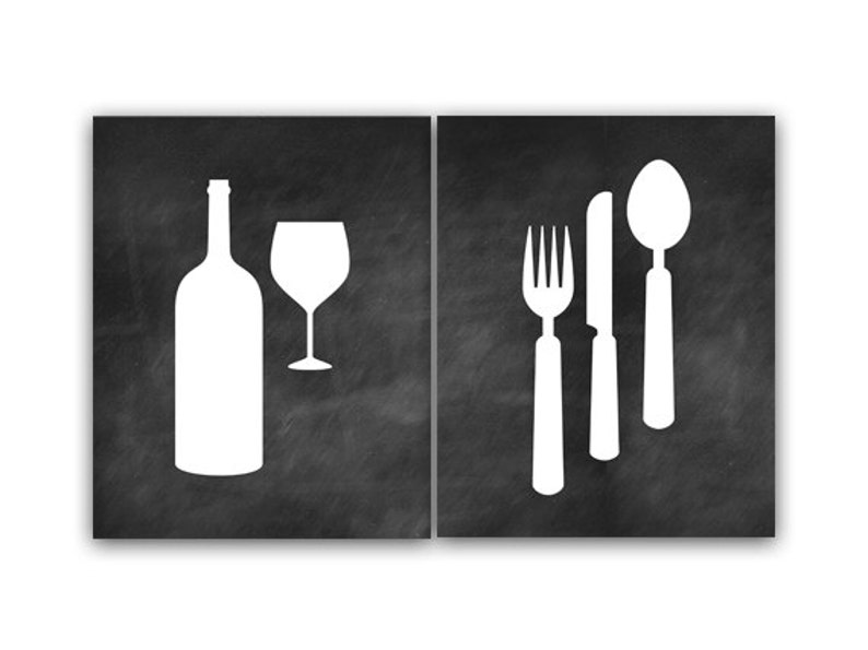 May include: Two black chalkboard signs with white silhouettes of a wine bottle and glass on one side and a fork, knife, and spoon on the other.