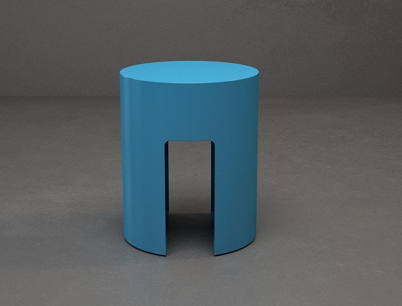 A turquoise cylinder side table made of metal , has a gap on the sides that begin ffom the bottom to the half of the base .it is useful as side table and end table .it has contemporary look