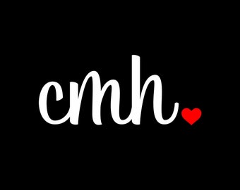 May include: White cursive text that reads "cmh." with a small red heart to the right of the text.