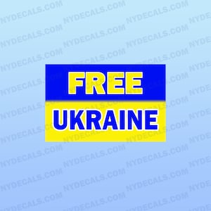 May include: A yellow and blue sign with the words "FREE UKRAINE" in bold blue letters.