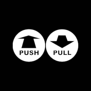 May include: Two white circles with black arrows and text. The left circle has an upward pointing arrow and the text "PUSH". The right circle has a downward pointing arrow and the text "PULL".
