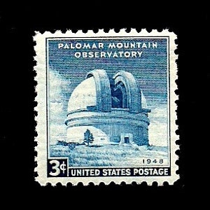 May include: A blue and white 3-cent United States postage stamp featuring a drawing of the Palomar Mountain Observatory, California, with the text "Palomar Mountain Observatory" and "1948" printed on the stamp.