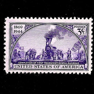 May include: A purple 3-cent postage stamp commemorating the completion of the First Transcontinental Railroad in 1869. The stamp features a steam locomotive and a group of people gathered around it. The text "1869 1944" and "COMPLETION OF FIRST TRANSCONTINENTAL RAILROAD" are printed on the stamp.