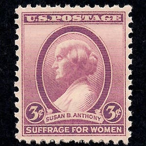 May include: A vintage U.S. postage stamp featuring a portrait of Susan B. Anthony in a purple oval. The stamp is purple with the text "U.S. POSTAGE", "3¢", "SUSAN B. ANTHONY", and "SUFFRAGE FOR WOMEN".