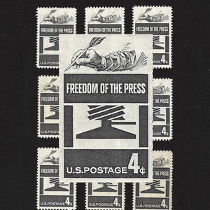 May include: A sheet of nine 4-cent postage stamps featuring the phrase "Freedom of the Press". The stamps depict a quill pen, a hand, and a stylized tree.