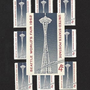 May include: Nine vintage United States postage stamps featuring the Space Needle in Seattle, Washington. The stamps are from the 1962 Seattle World's Fair and each stamp has a 4-cent denomination.