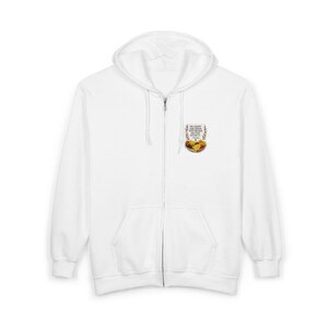 May include: White zip-up hoodie with a hood and a front pocket. The hoodie features a small graphic on the upper left chest with text and an illustration of food. The text reads "The energy you radiate is what the world reflects back to you."