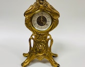 f462 Vintage West Germany Mantel Standing Clock Carved Cupid