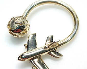v985 Tiffany & Co. Llavero de plata de ley 925 con globo terráqueo figurativo de avión