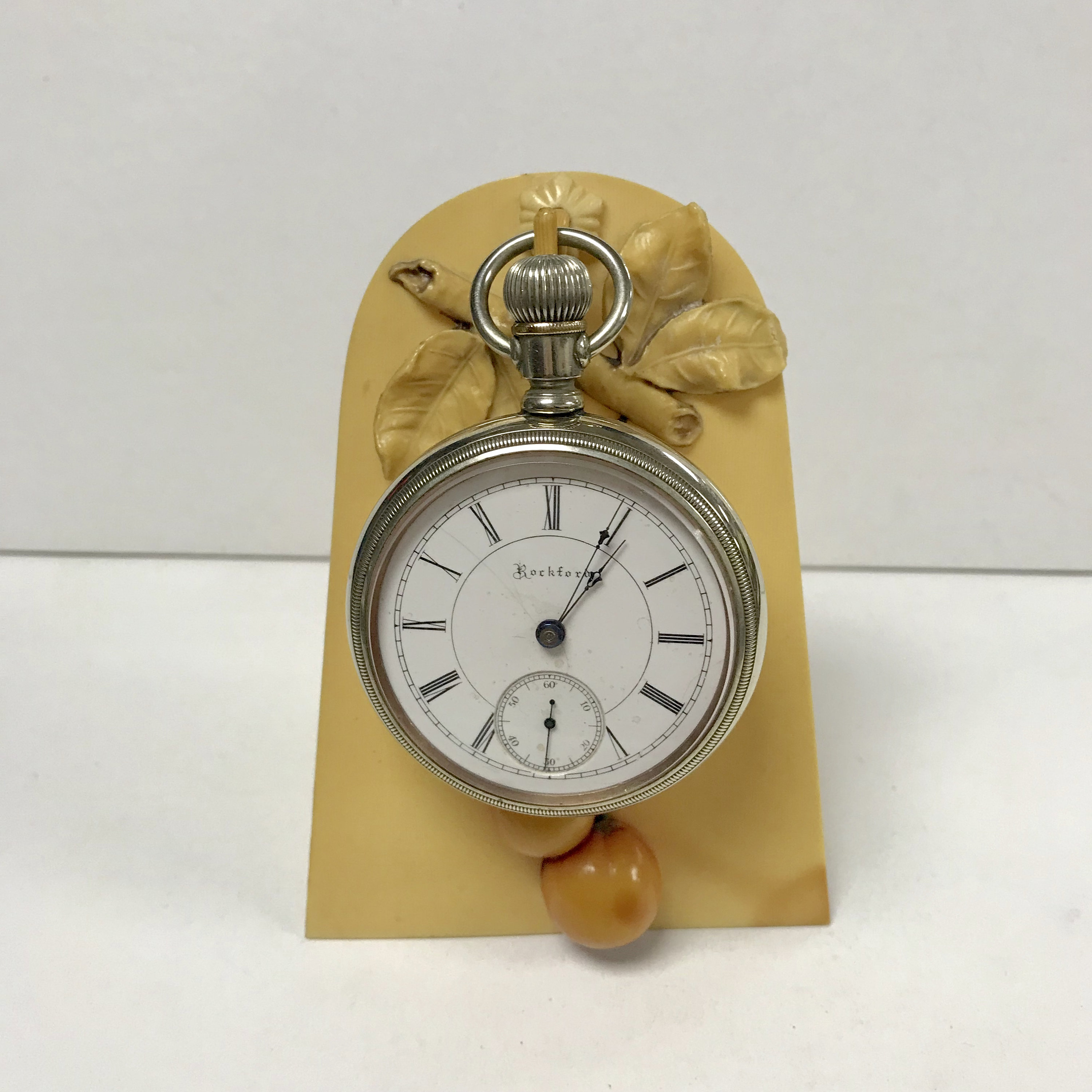 Pocket watch holders top