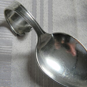 h643 Vintage Sterling Silver Curved Handle Baby Spoon by Radar
