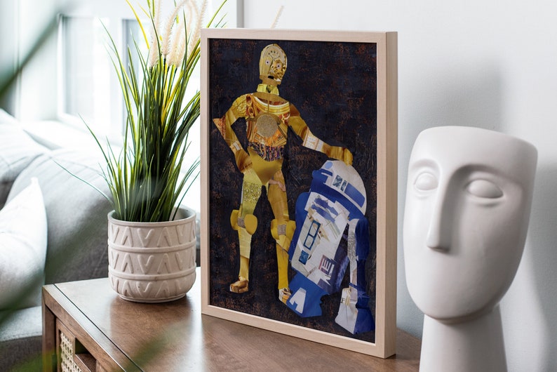 May include: A framed collage artwork featuring C-3PO and R2-D2 from Star Wars. The artwork is made of paper and has a vintage, distressed look.