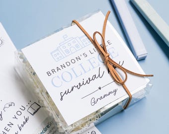 May include: A clear plastic box tied with a brown leather cord, containing a gift set labeled "Brandon's Little College Survival" with a school illustration. Includes cards and cash, with text "For when you are feeling sick."