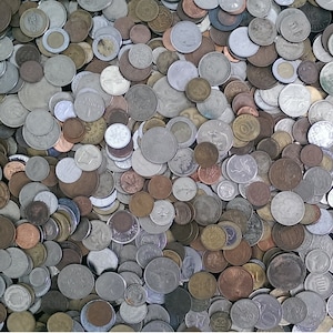 May include: A large collection of various coins in different sizes, shapes, and colors. The coins are mostly silver and gold, with some copper and bronze coins. The coins are arranged in a random pattern, creating a visually interesting and textured surface.