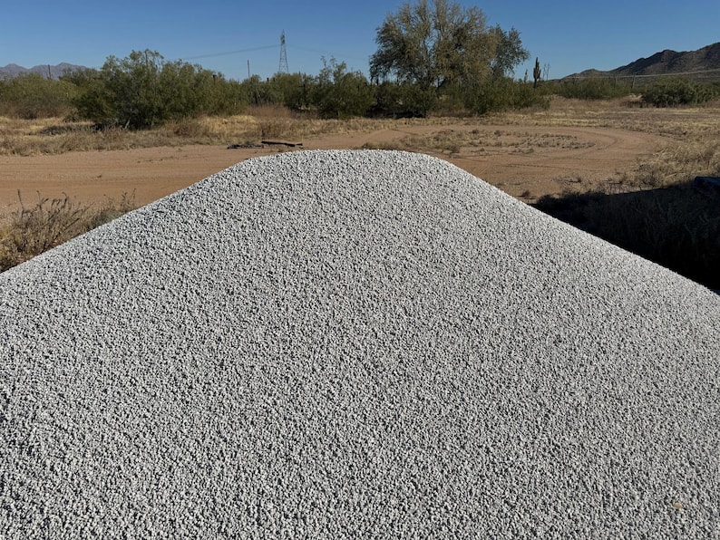 May include: A large pile of gray gravel, likely used for landscaping or construction.