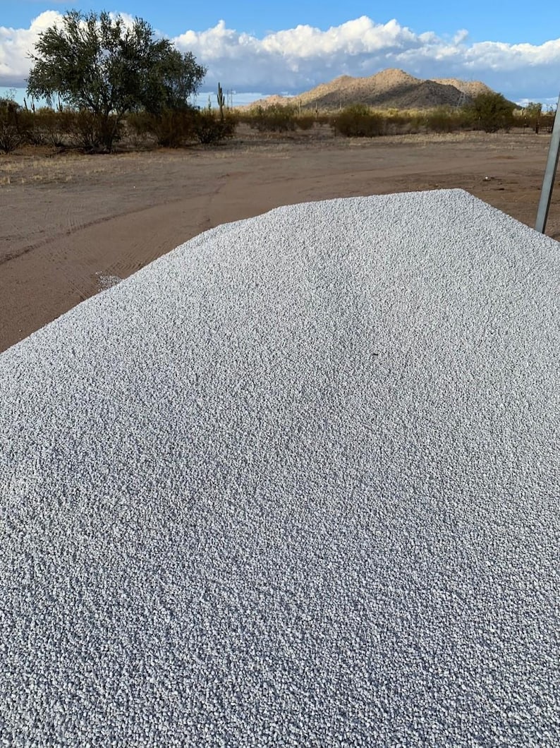 May include: A large pile of white gravel, likely used for landscaping or construction.