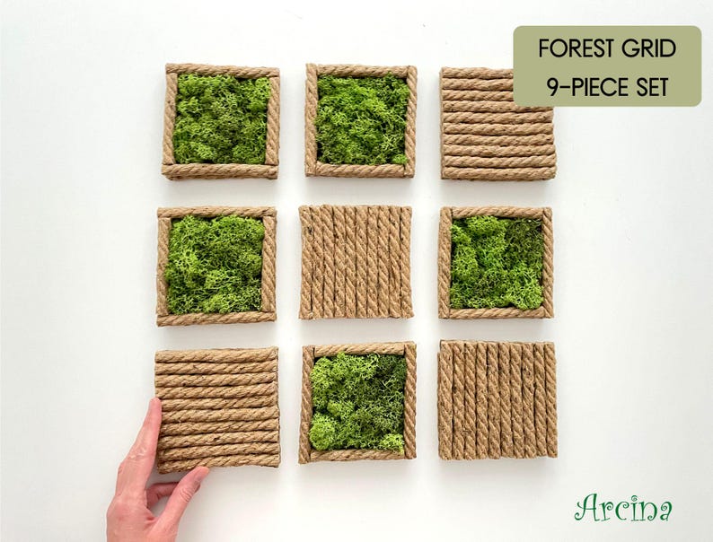 May include: A 9-piece Forest Grid set featuring square frames made of twisted brown rope. Five frames are filled with vibrant green preserved moss, while four frames are filled with horizontal or vertical rows of the same twisted brown rope.