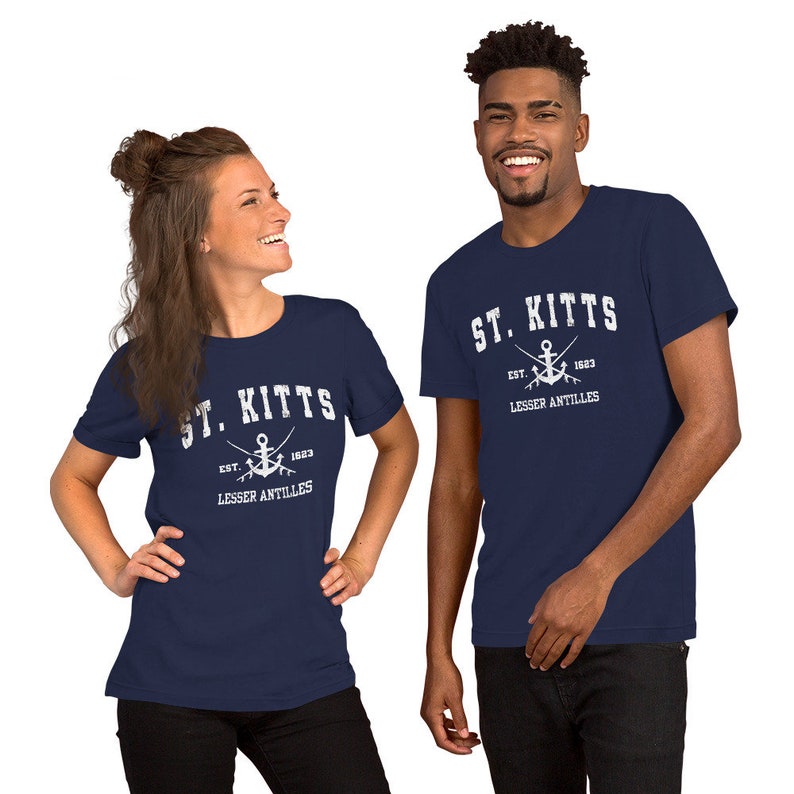 May include: Two navy blue t-shirts with a white graphic of an anchor and the text "ST. KITTS EST. 1623 LESSER ANTILLES".