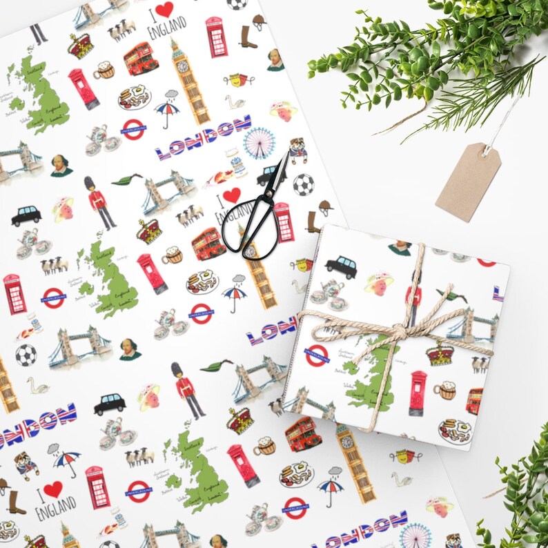 May include: White wrapping paper with a repeating pattern of London themed illustrations. The illustrations include a red double-decker bus, a red telephone booth, a Union Jack flag, a Big Ben clock tower, a map of England, and the words "London" and "I love England".