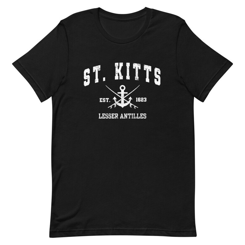 May include: Black t-shirt with white text that reads "ST. KITTS EST. 1623 LESSER ANTILLES" and a white anchor with crossed oars.
