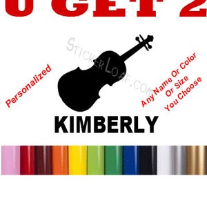 May include: A black and white silhouette of a violin with the text "U GET 2" in red letters above it. The text "KIMBERLY" is below the violin. A color chart of vinyl colors is at the bottom of the image.