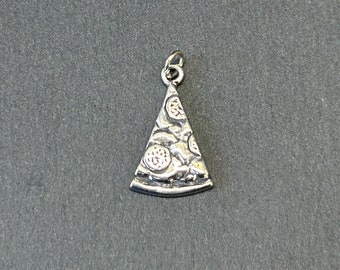 May include: A silver-colored pizza slice charm with a textured surface, featuring detailed toppings. The charm has a small loop at the top for attaching to a necklace or bracelet. The charm is a food-themed jewelry item.