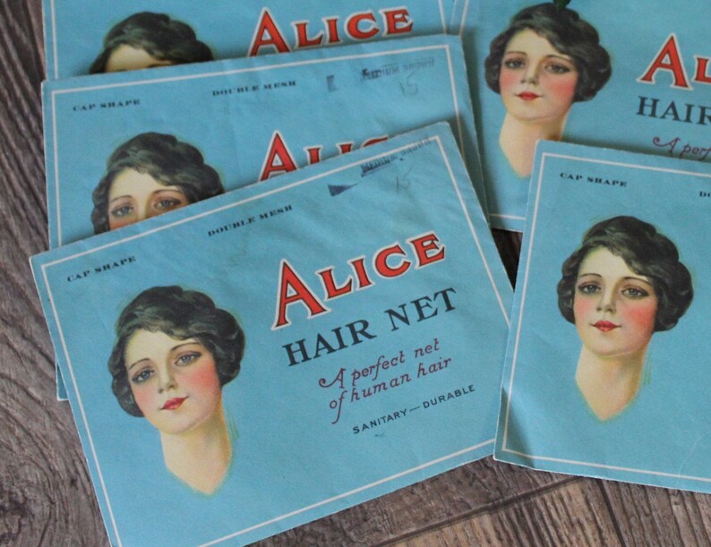 May include: A blue and white package for Alice Hair Net. The package features a woman with dark hair and a white dress. The text on the package reads "Alice Hair Net, A perfect net of human hair, Sanitary-Durable".
