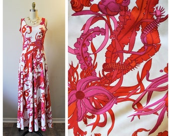 May include: A white maxi dress with a pink and red floral print featuring seahorses, starfish, and seaweed. The dress has a sleeveless design and a fitted bodice.