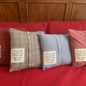 May include: Four decorative pillows made from repurposed shirts with the text "This is a shirt I used to wear Whenever you Hold it know I am there" embroidered on each pillow.