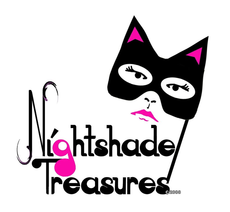 May include: Black and white logo with the text "Nightshade Treasures" and a pink cat mask with eyelashes. The text "C 2008" is in the bottom right corner.