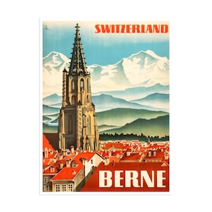 May include: Vintage travel poster advertising a trip to Switzerland, featuring a view of the city of Bern with a tall church steeple and snow-capped mountains in the background. The poster is in red, white, and blue colors with the text "SWITZERLAND" and "BERNE" in bold white letters.