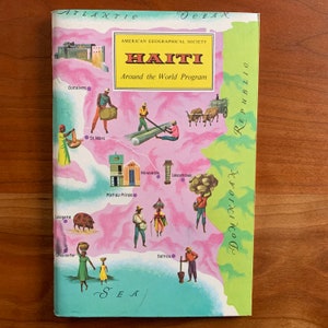 May include: A vintage book cover titled "HAITI" from the American Geographical Society's "Around the World Program." The cover features a map of Haiti with illustrations of people and landmarks, in shades of pink, green, and blue.