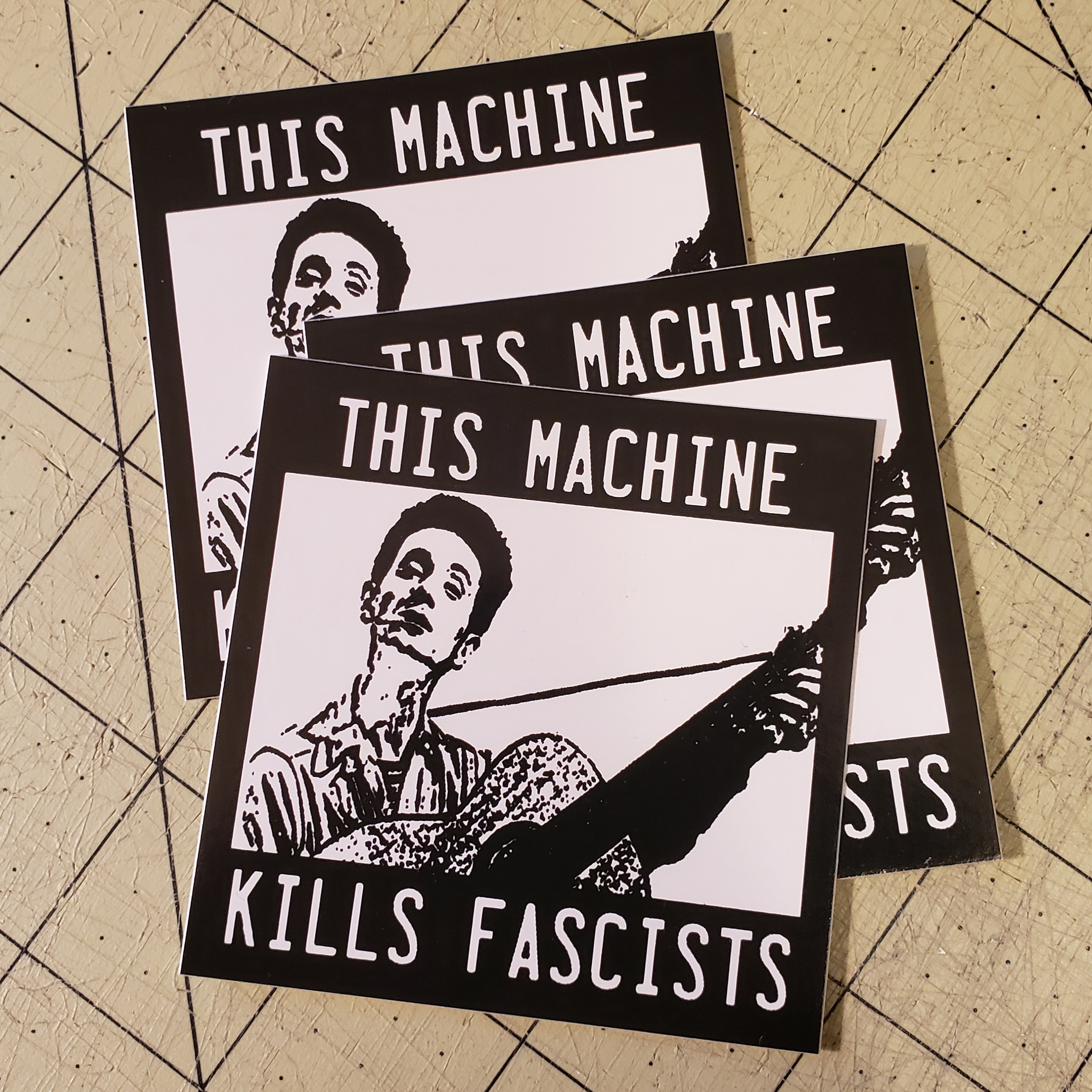 Vinyl Sticker - (small) Woody Guthrie This Machine Kills Fascists