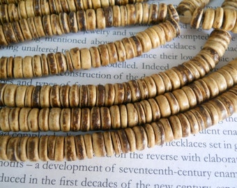 8mm tumbled coconut heishi beads, 15.5" strand long.