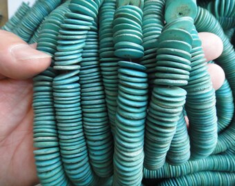 180 beads, dyed turquoise 15mm tumbled coconut heishi beads.