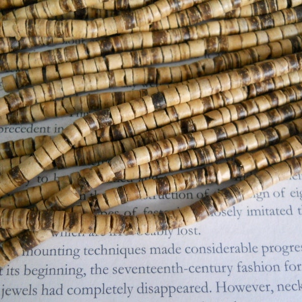 5mm coconut heishi beads, 22" strand long.