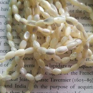 50 beads, 7mm nature shell rice beads, MOP oval beads.