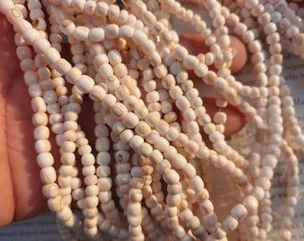 Puka like nature beige tumbled shell rondelle beads, about 5mm, 15 inch long
