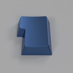 May include: A blue plastic keycap with a unique design. The keycap is designed to fit a standard mechanical keyboard.