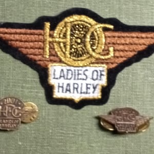 May include: A rustic wooden sign with the text "Welcome to our home" in white lettering. The sign features a distressed finish and a simple, inviting design, perfect for a front porch or entryway.