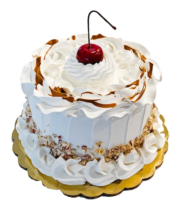 DEZICAKES Fake Cake White Cake With Nuts Chocolate Drizzle