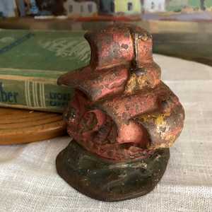 Heavy cast iron sailing ship bookend or doorstop with vintage patina