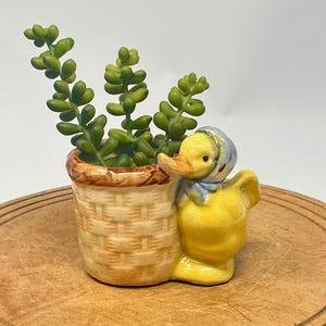 May include: A rustic wooden sign with the text "Welcome to our home" in white lettering. The sign features a distressed finish and a simple, inviting design, perfect for entryway decor.